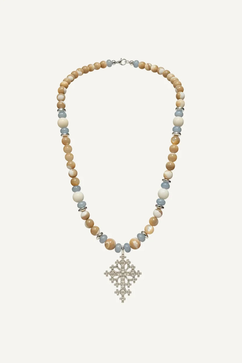 Beaded necklace with a cross pendant on blouse roumaine shop
