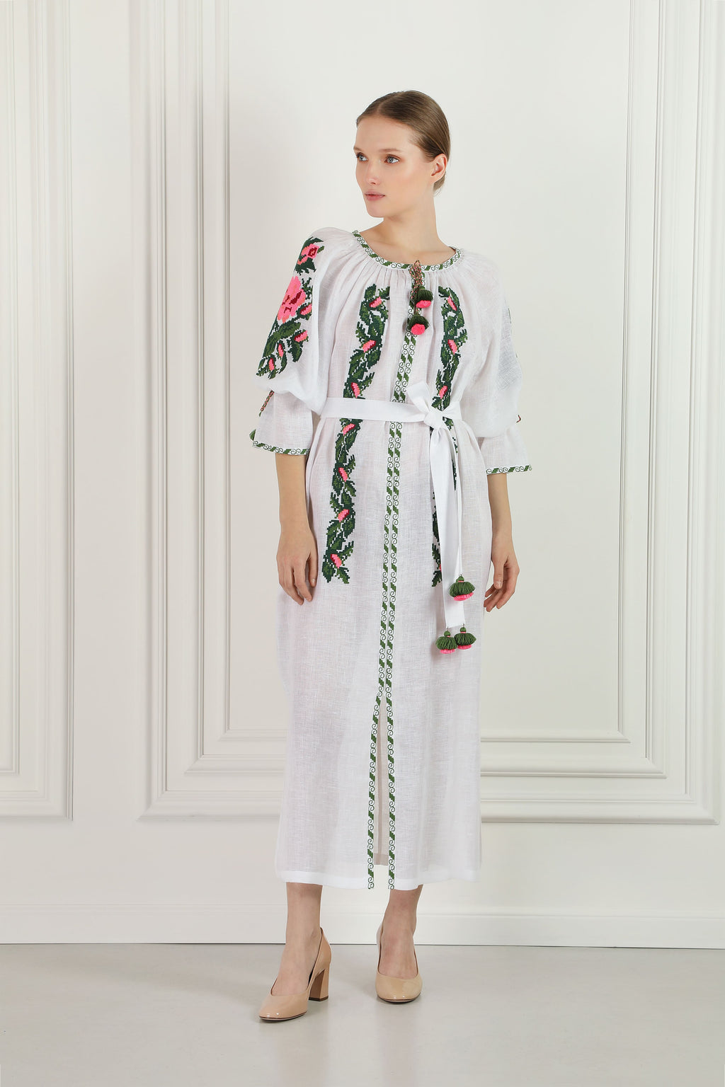 Model wearing the floral embroidered white linen beach tunic