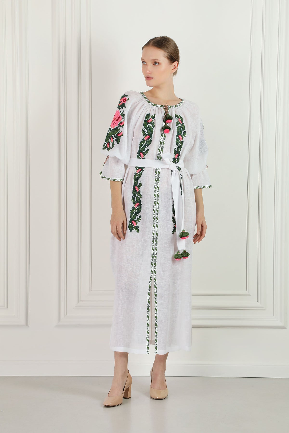 Model wearing the floral embroidered white linen beach tunic
