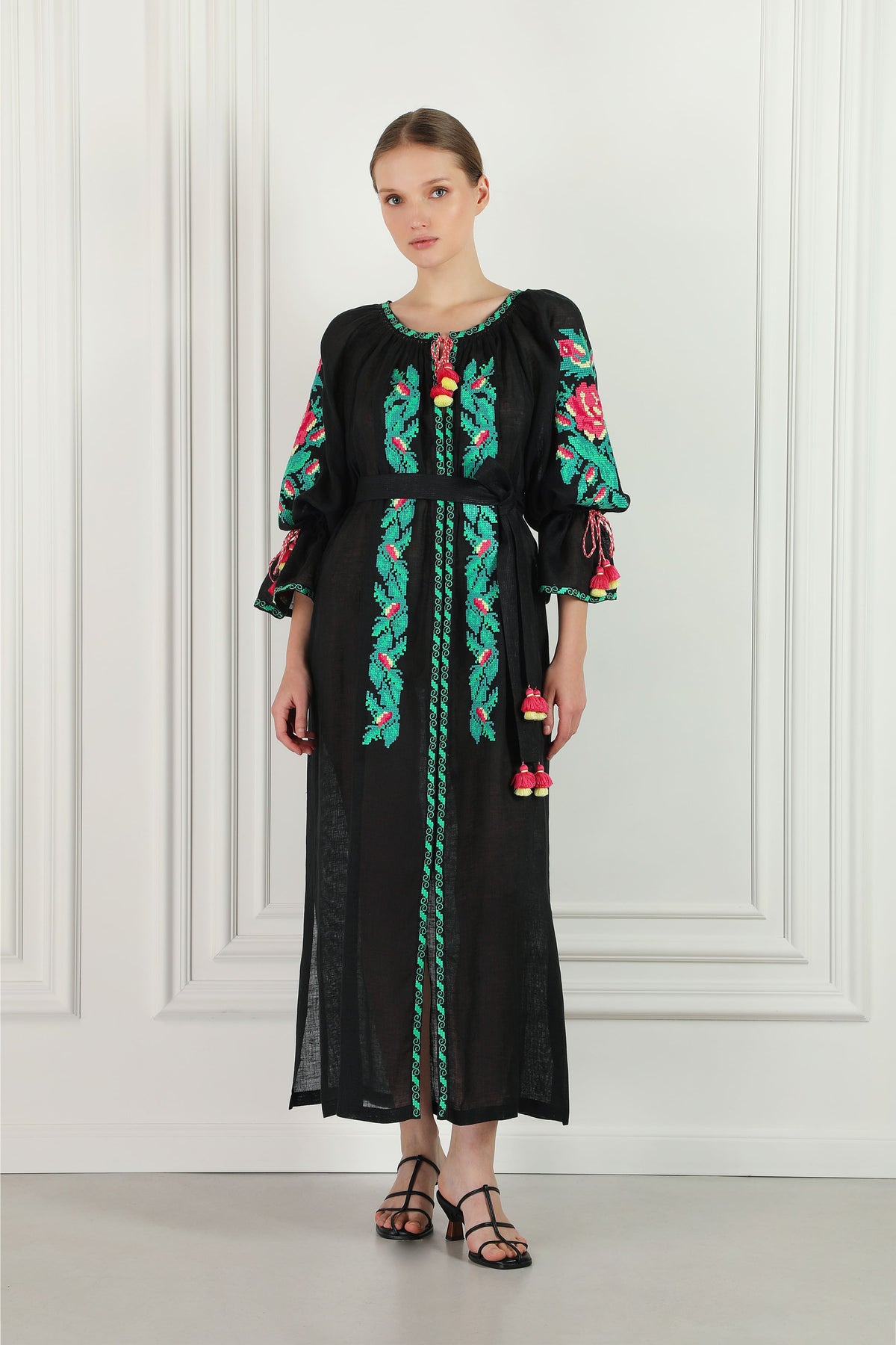Model wearing the oversized floral hand-embroidered linen beach tunic