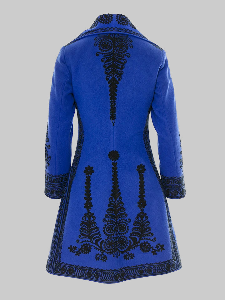 Blue coat with black intricate patterns on a white background