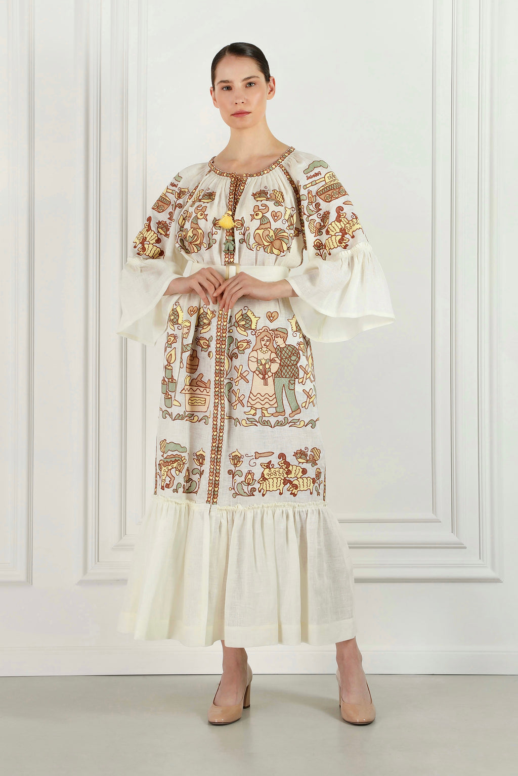 Model wearing the Embroidery History beige linen maxi dress
