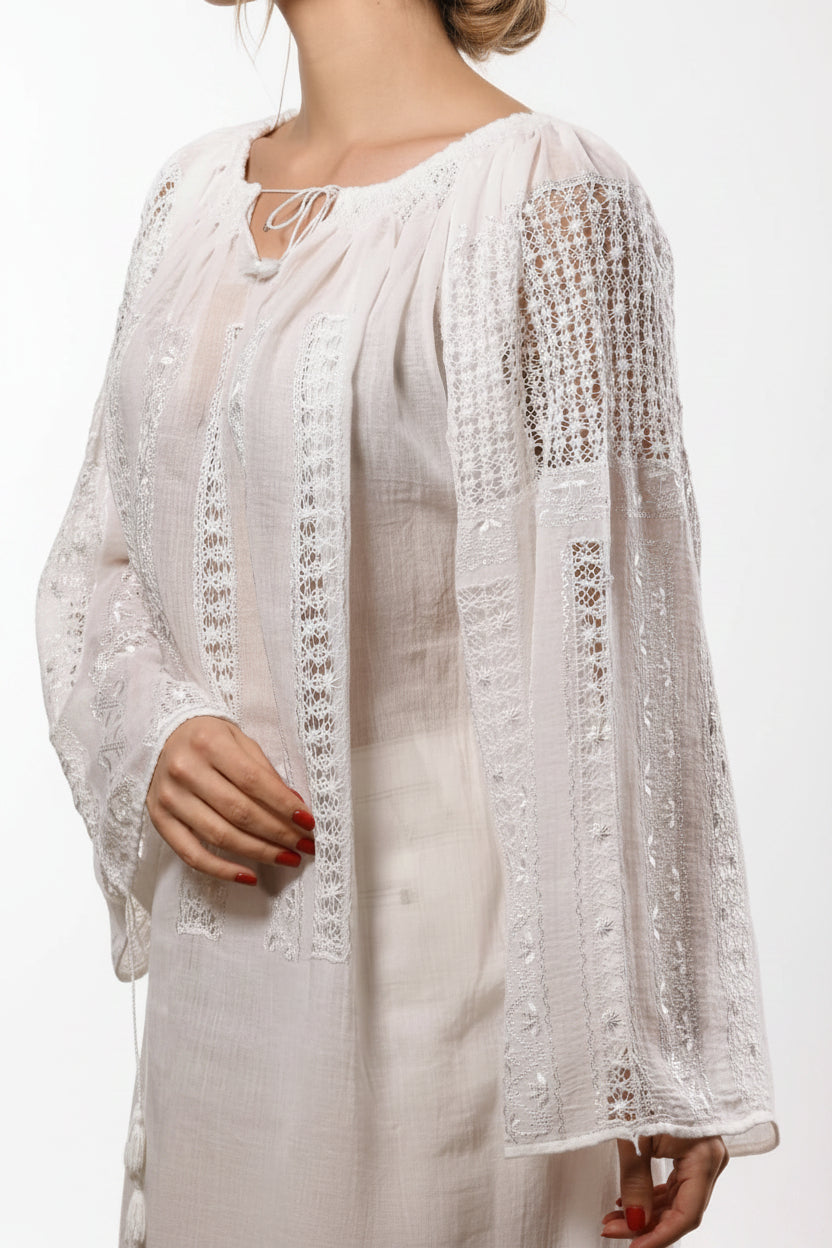 White lace dress with sheer sleeves on a white background