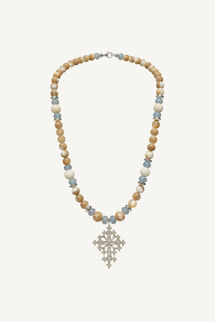 Beaded necklace with a cross pendant on blouse roumaine shop