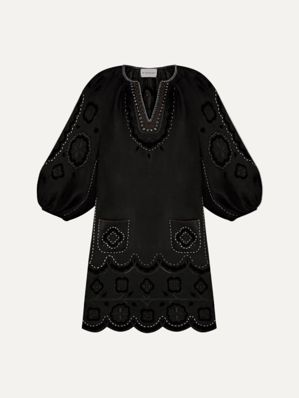 Black dress with intricate patterns on a white background