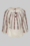 White blouse with brown embroidery on a white background