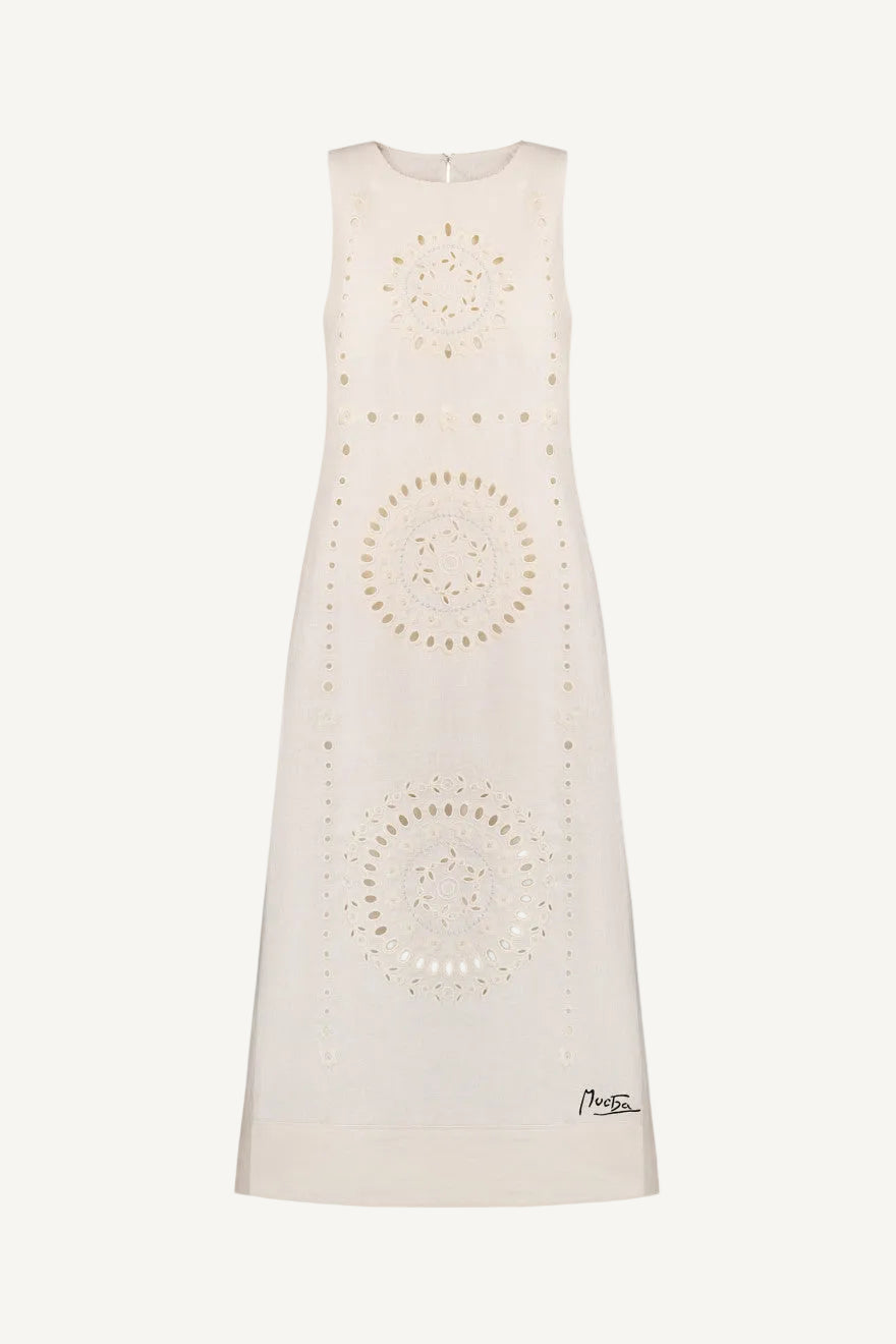 White sleeveless dress with circular patterns on a white background