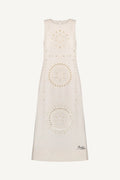 White sleeveless dress with circular patterns on a white background
