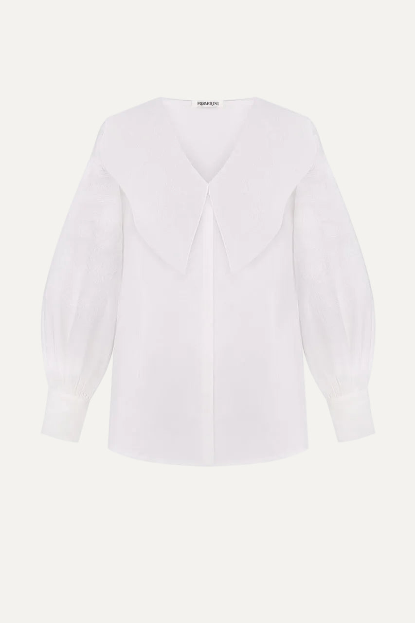 White embroidered blouse with a V-neck and long sleeves 