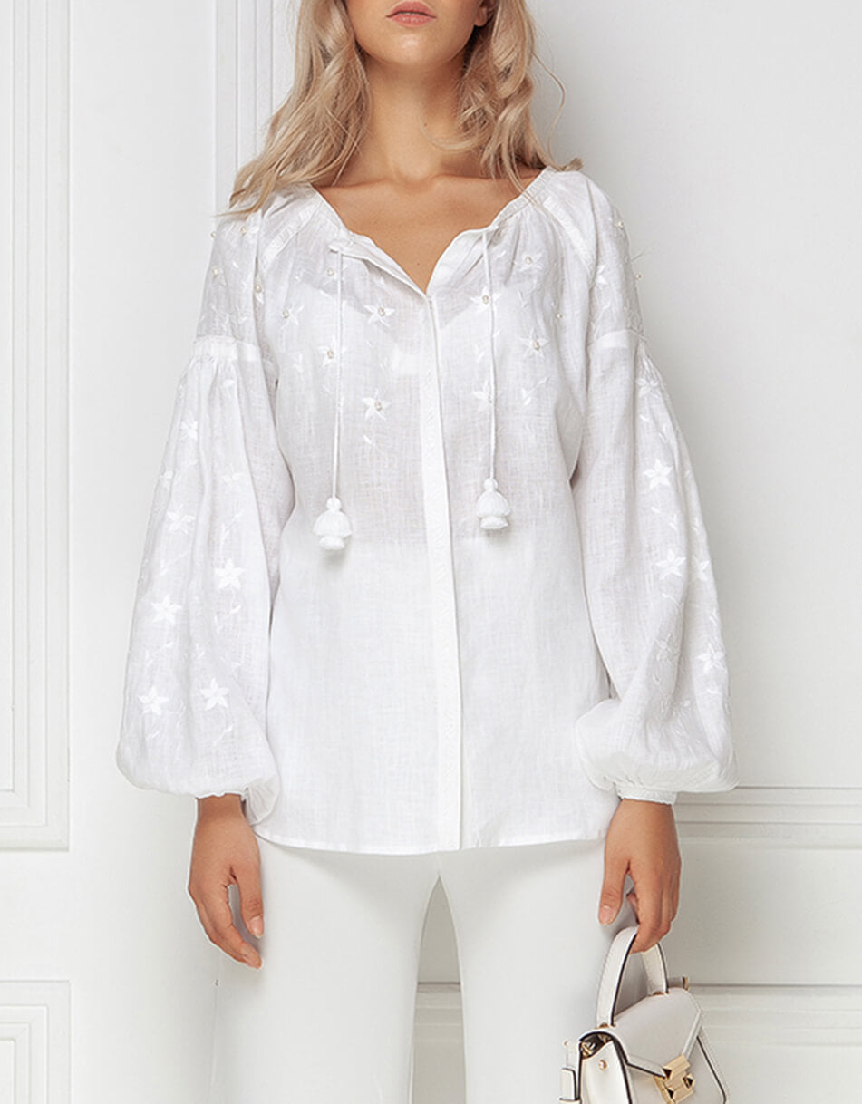 Model wearing the white linen pearl-beaded bohemian peasant blouse