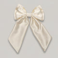 Large cream-colored bow on a white background