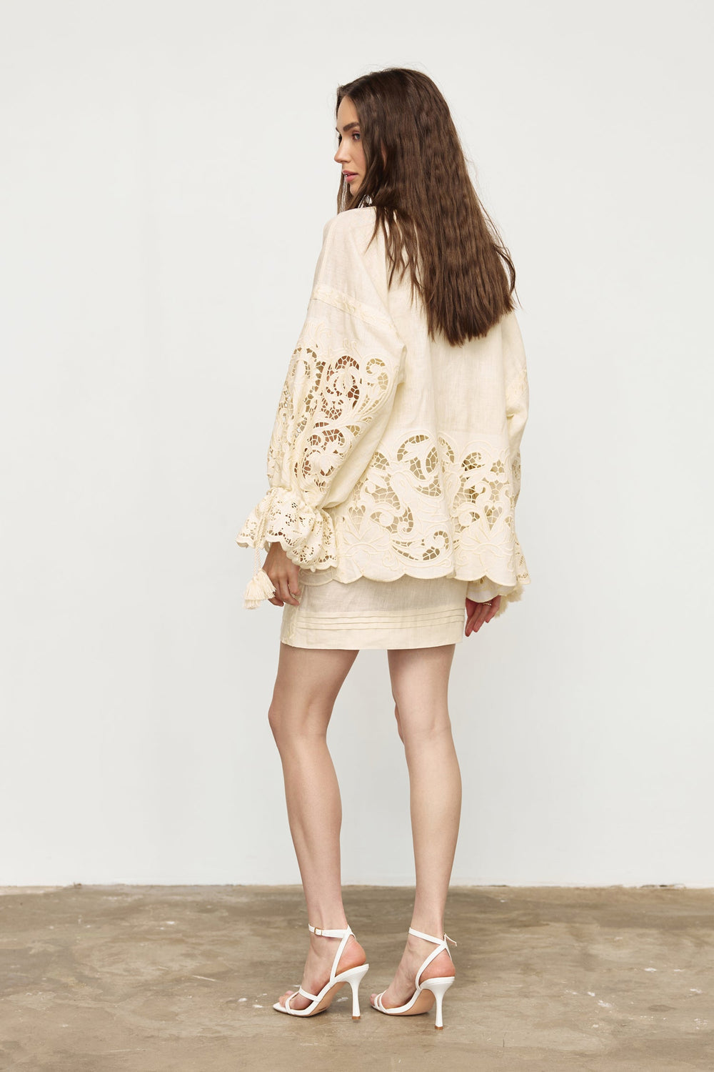 Hand-embroidered folk linen skirt with Richelieu cutwork in ivory – back view