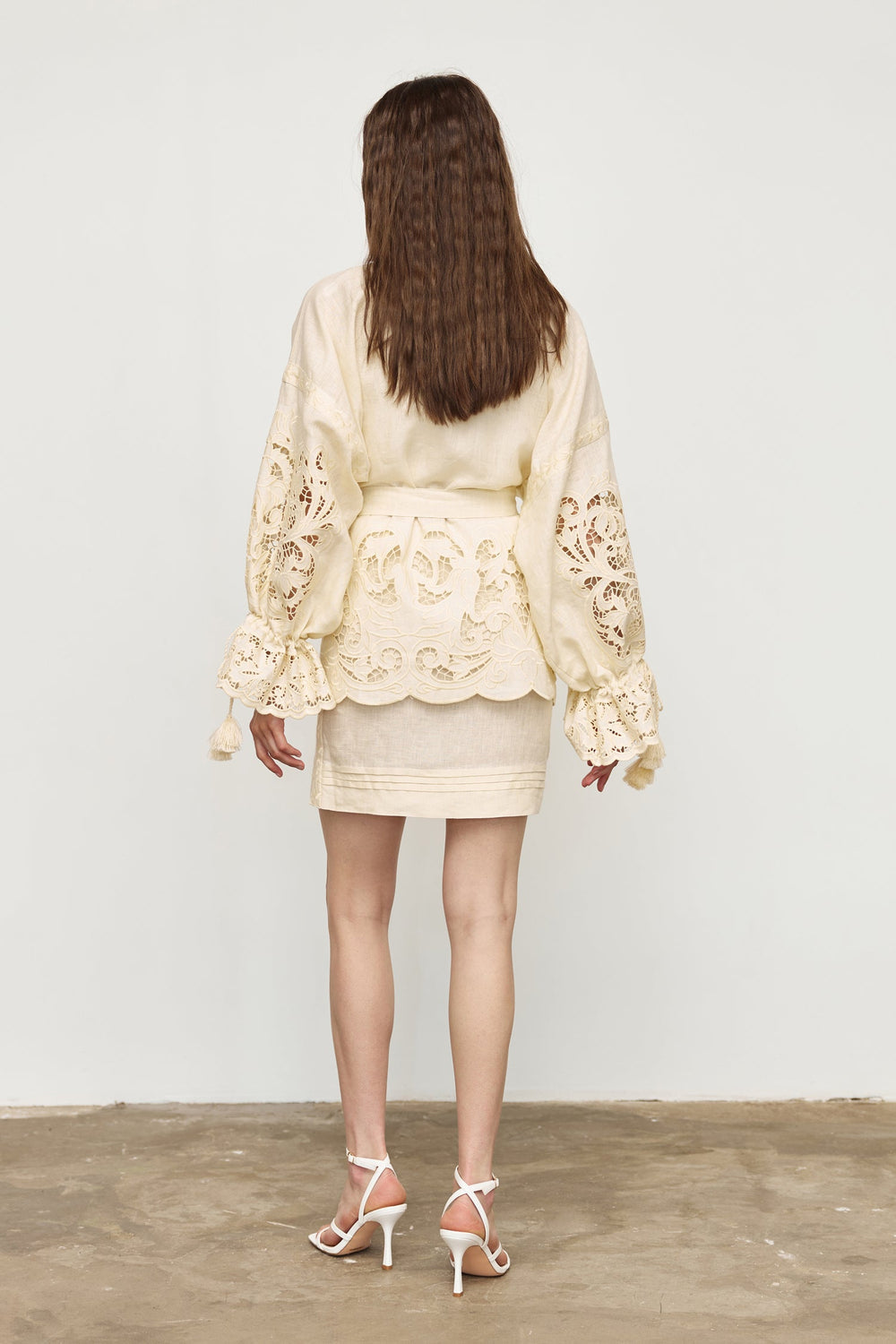 Hand-embroidered folk linen skirt with Richelieu cutwork in ivory – styled look