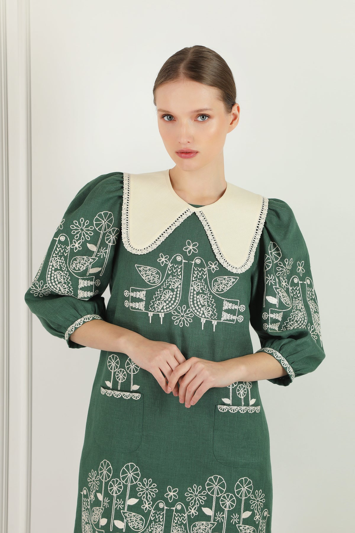 Zozulya green linen mini dress - buttoned cuff on 3/4 volume sleeve