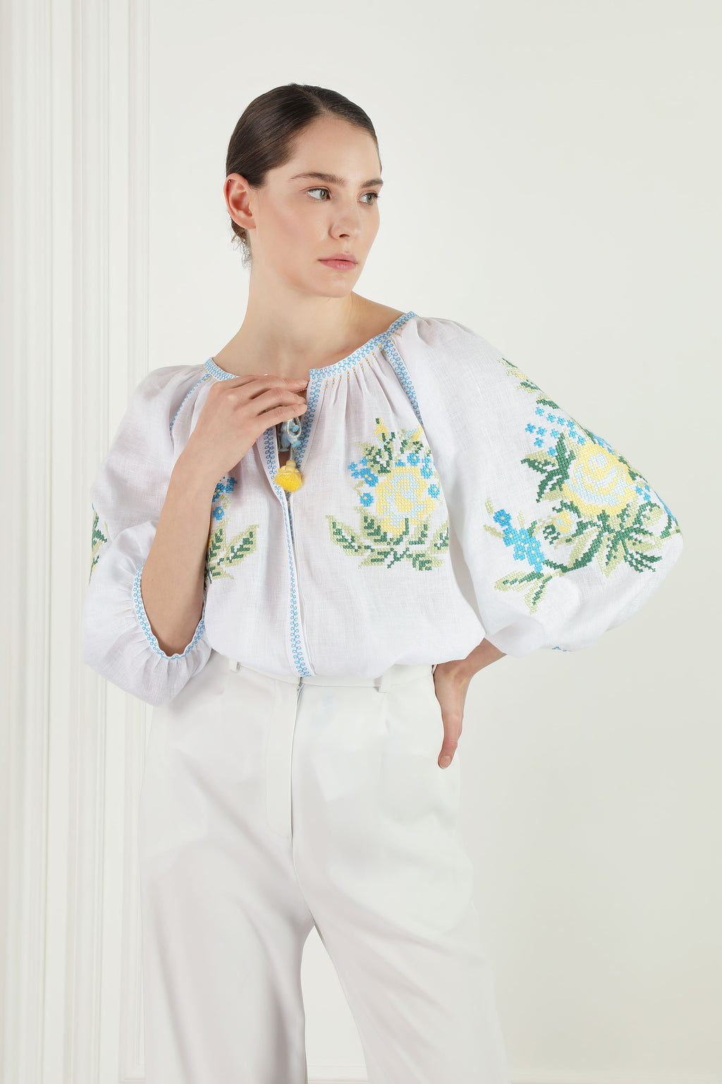 Evelyn white linen blouse, floral cross-stitch chest embroidery detail
