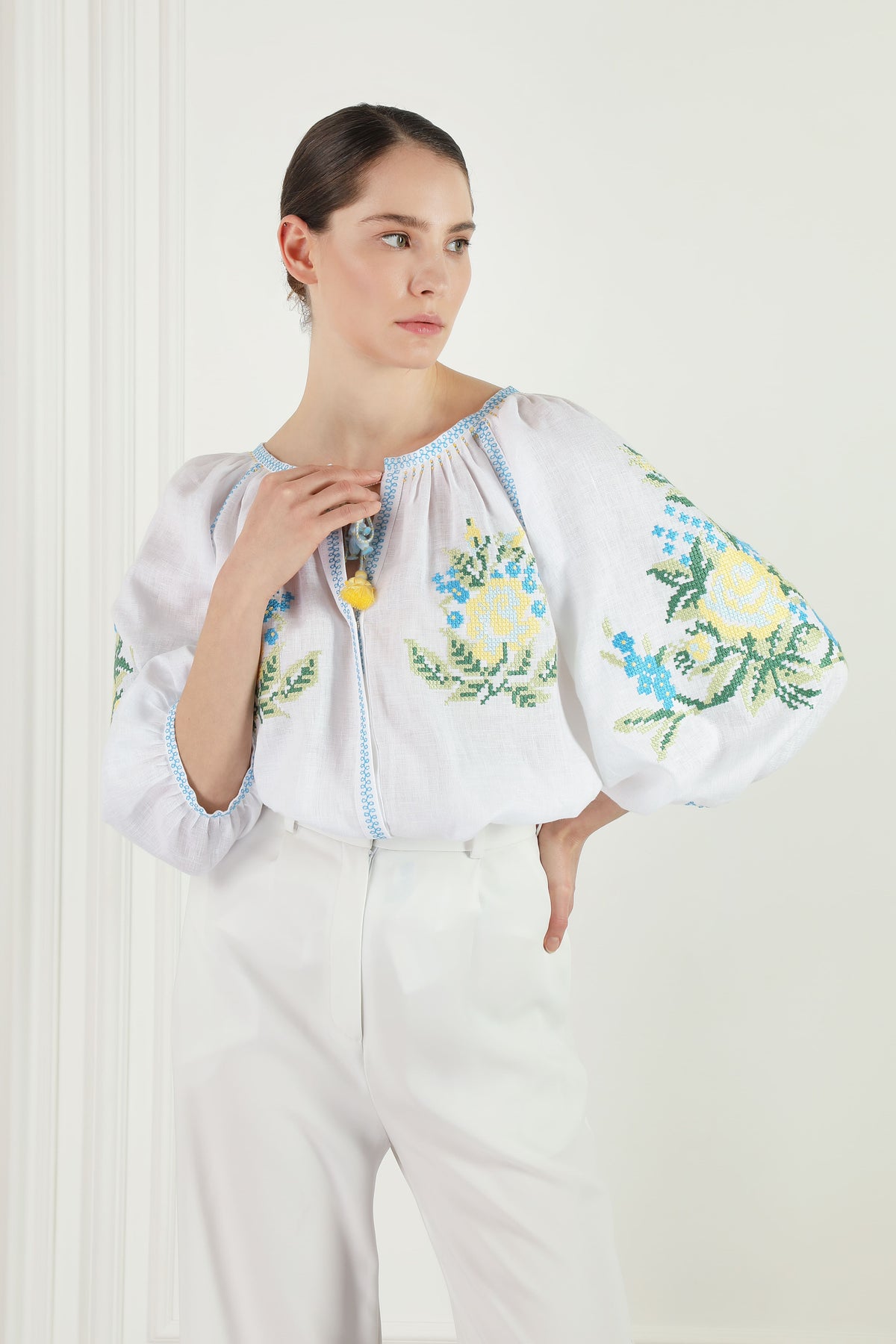 Evelyn white linen blouse, floral cross-stitch chest embroidery detail