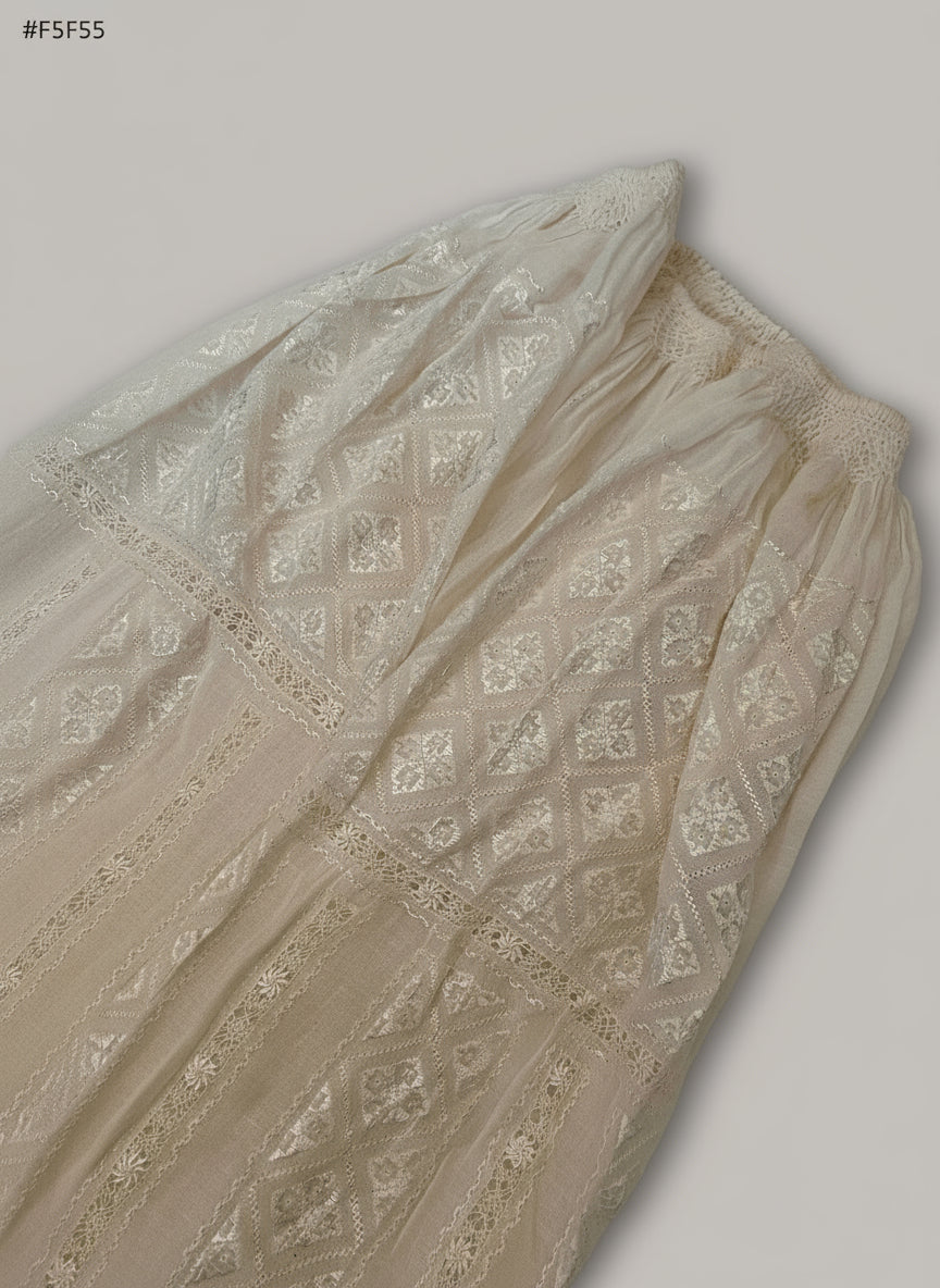 Beige fabric with intricate patterns on a light gray background