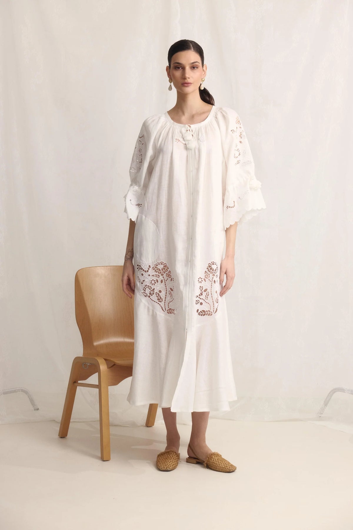 Model wearing the Tree of Life white linen maxi dress