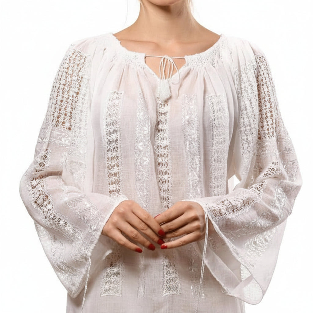 White lace top worn by a person on a white background