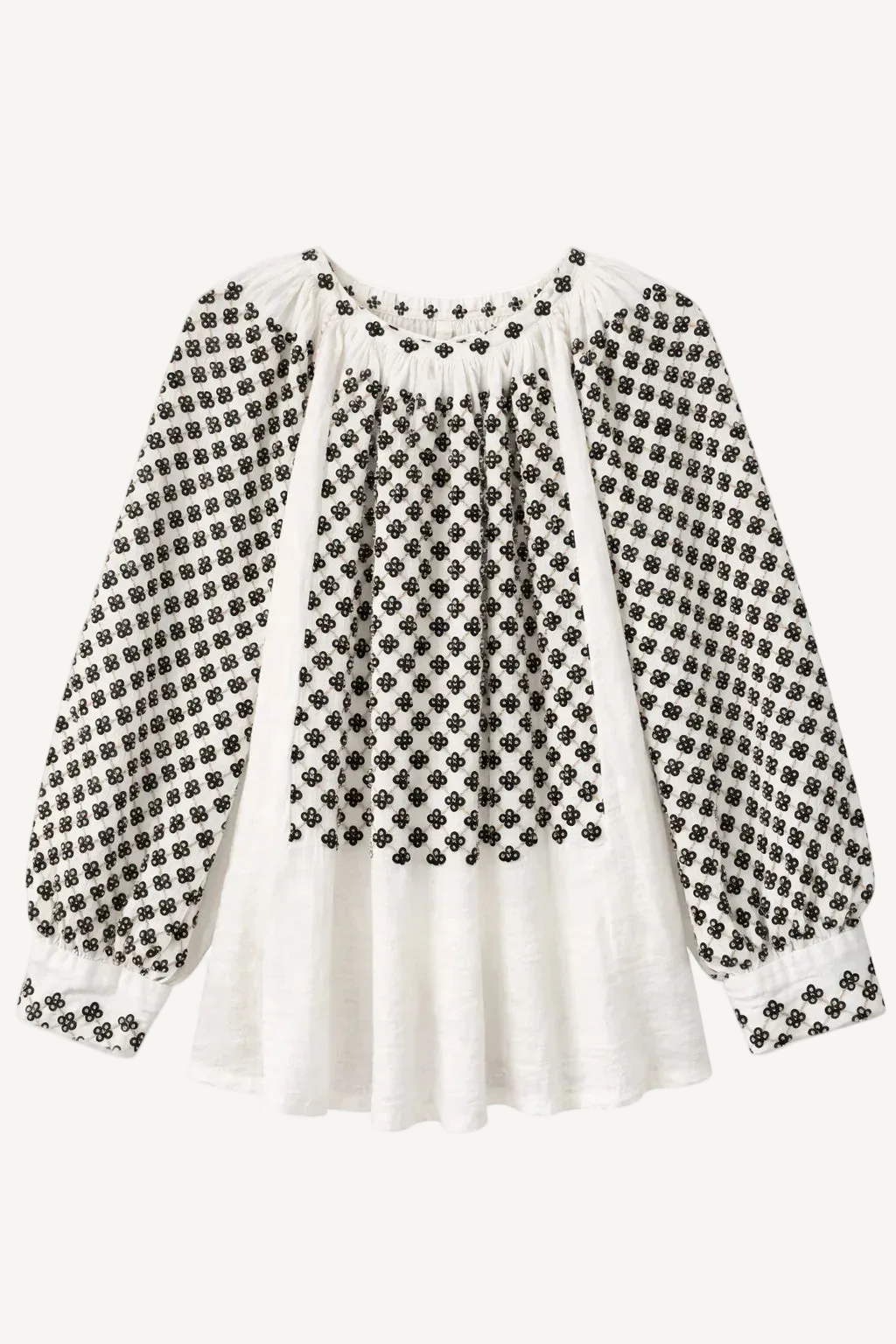 White blouse with black floral pattern on a white background