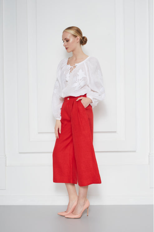 Model wearing the Eden white tonal-embroidered linen blouse