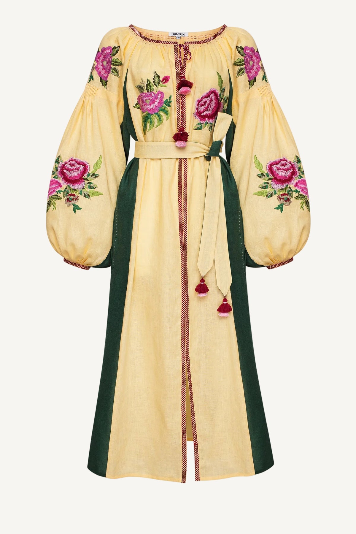 A long cream-colored dress with dark green side panels, featuring pink rose floral embroidery on the bodice and sleeves, and red tassels Blouse Roumaine Shop