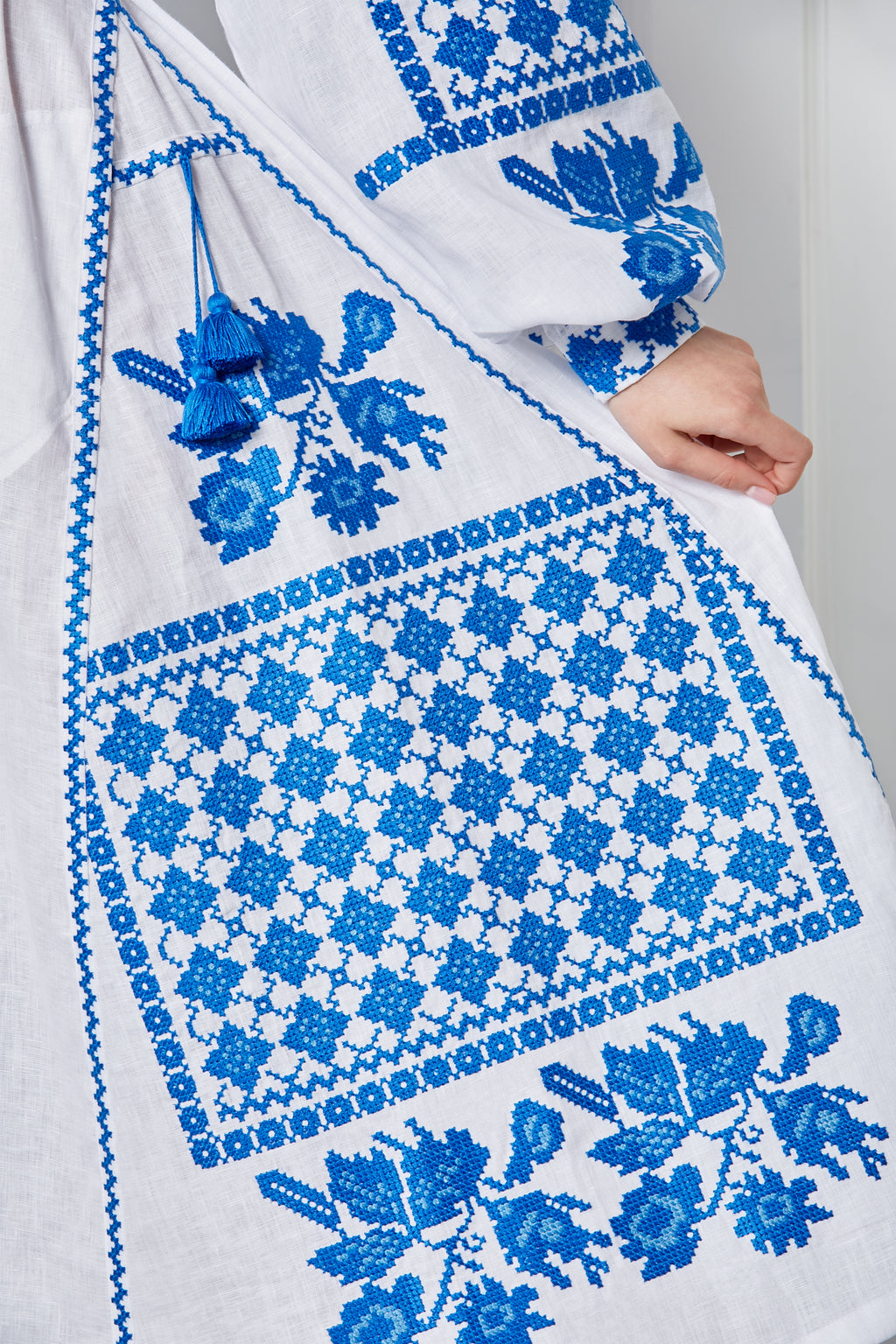 Model wearing the white Ukrainian embroidered midi dress