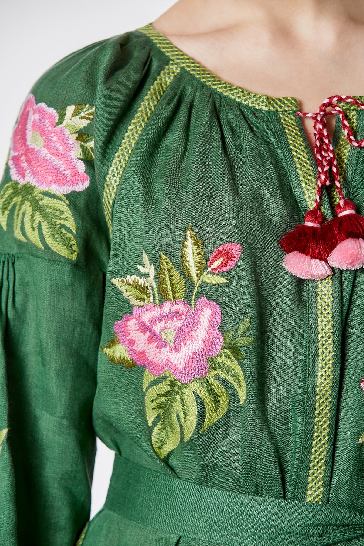 Model wearing the Flora green embroidered midi dress by Foberini