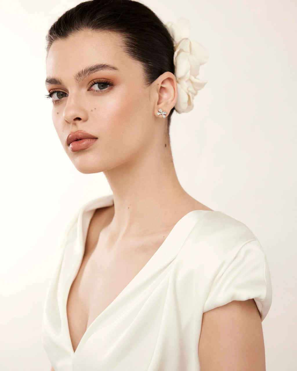 Amira flower hair accessory worn to the side