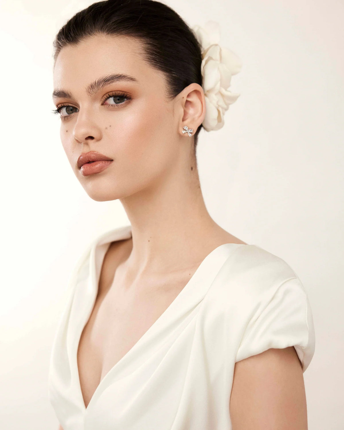 Amira flower hair accessory worn to the side
