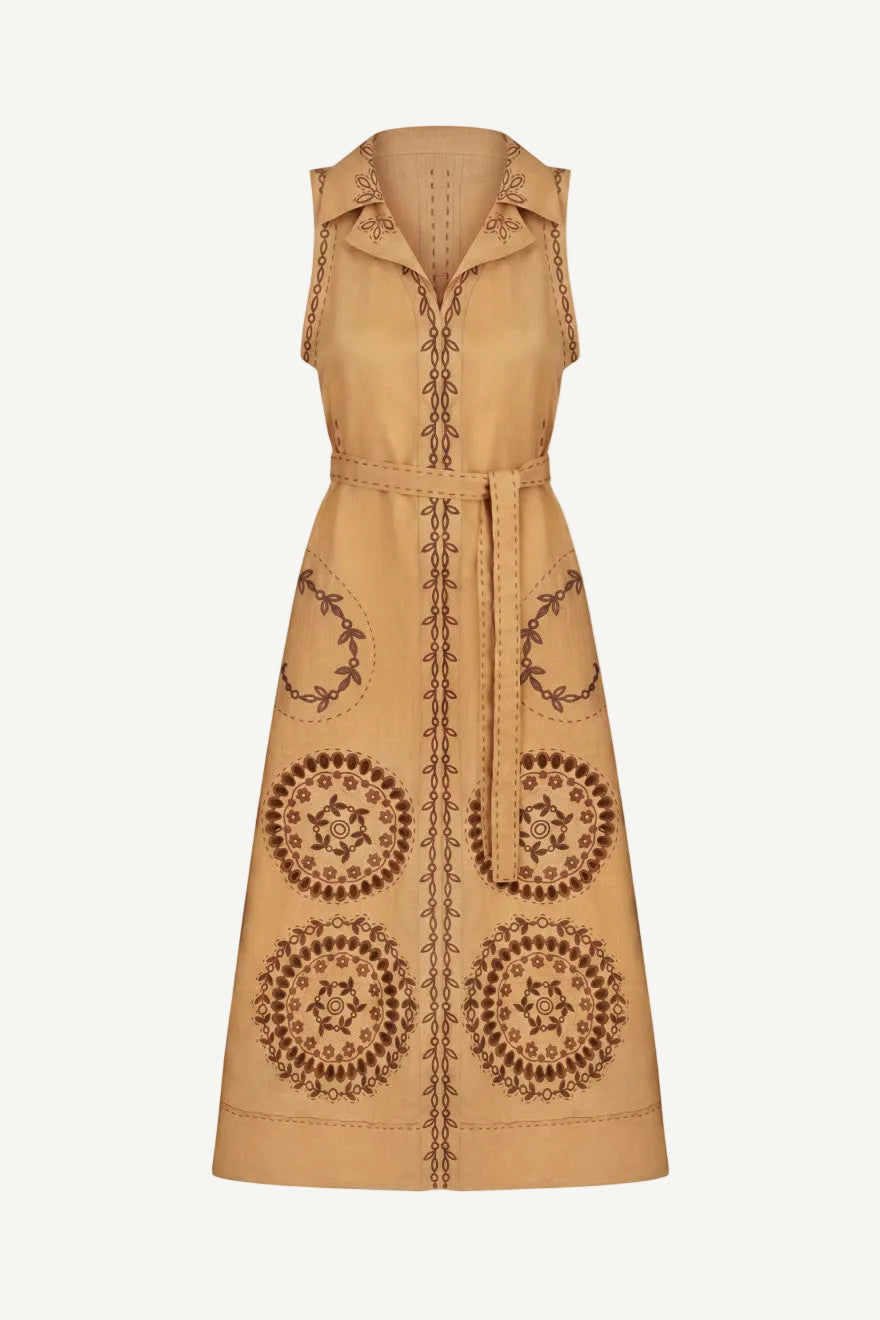 Beige sleeveless dress with intricate brown patterns on a white background
