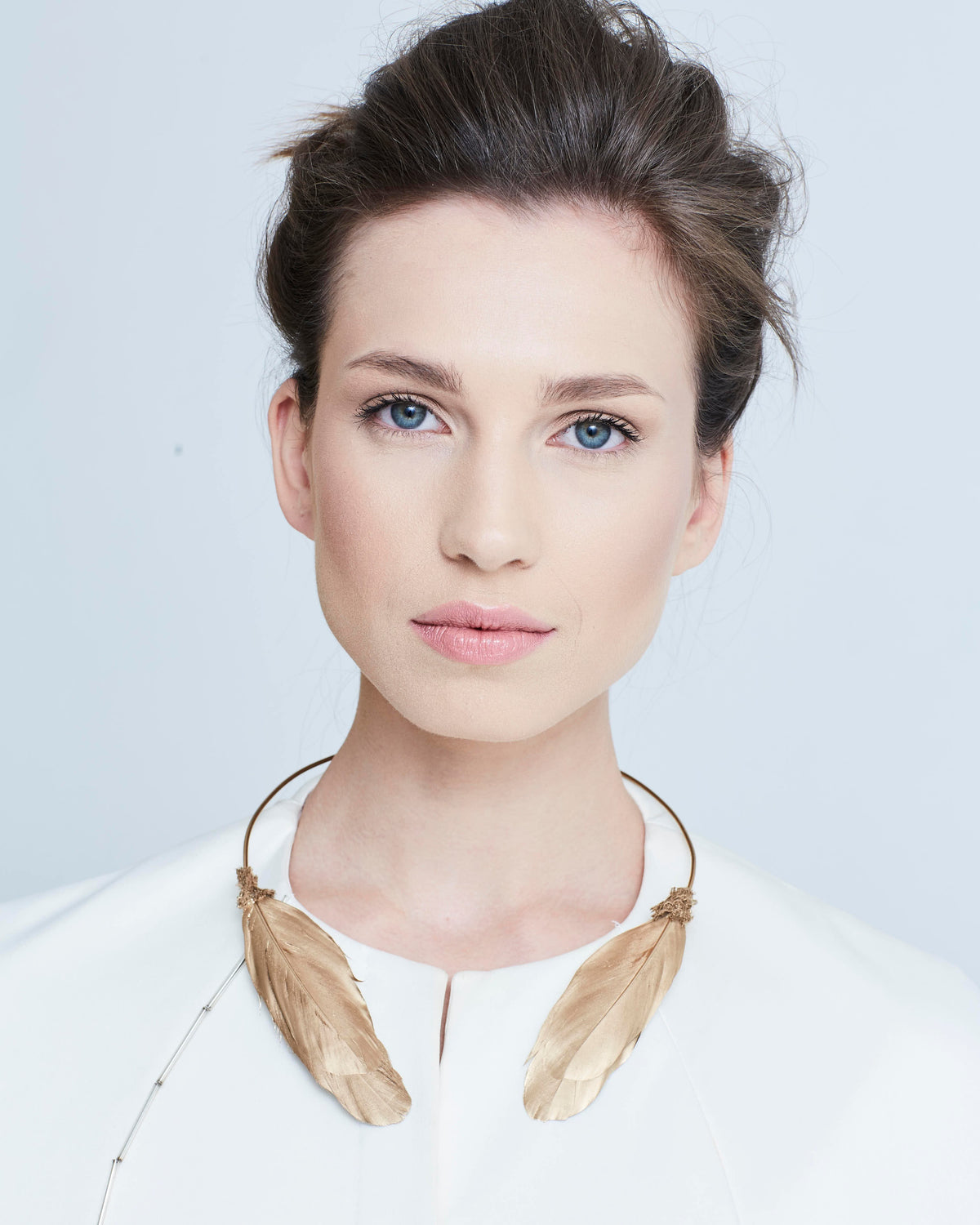 Katerini Mou swan feather necklace in brass with feather accents