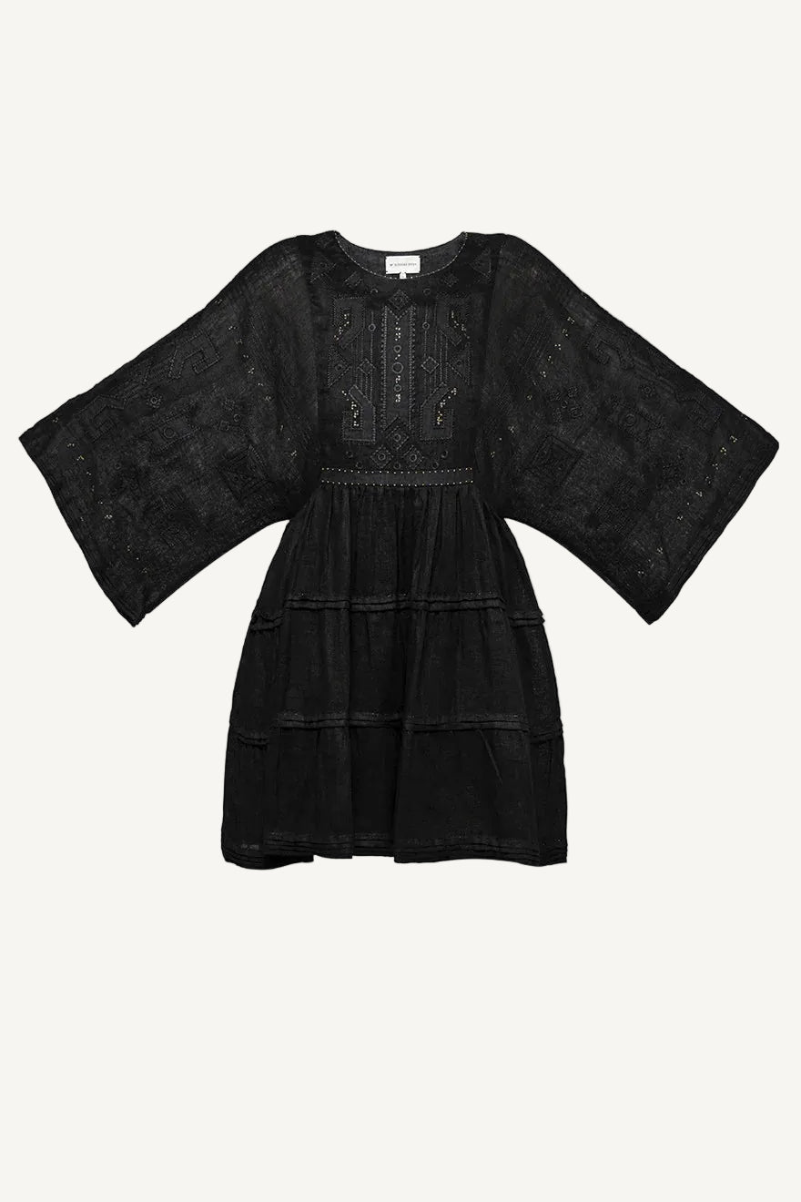 Black dress with sheer lace detailing on a white background