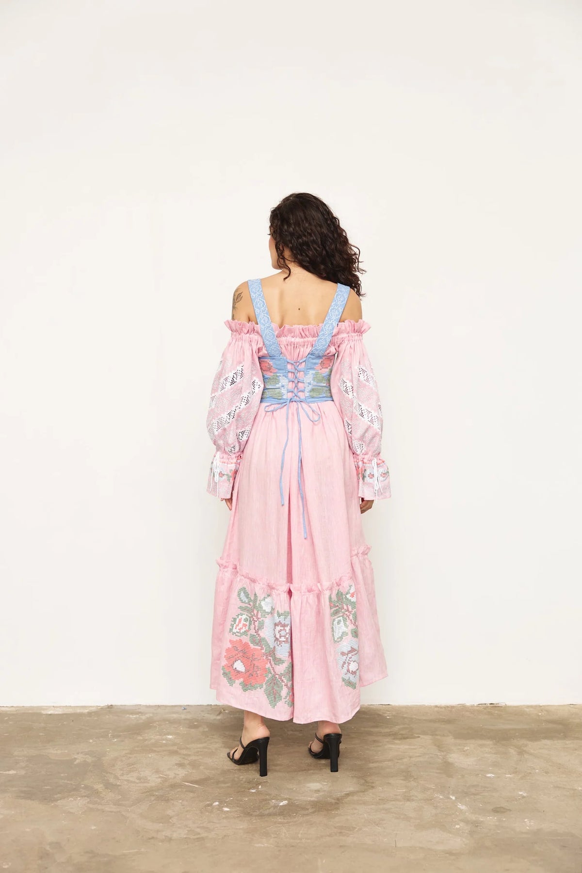 Model wearing ANNABO Elysian Whisper blush pink off-the-shoulder linen maxi dress