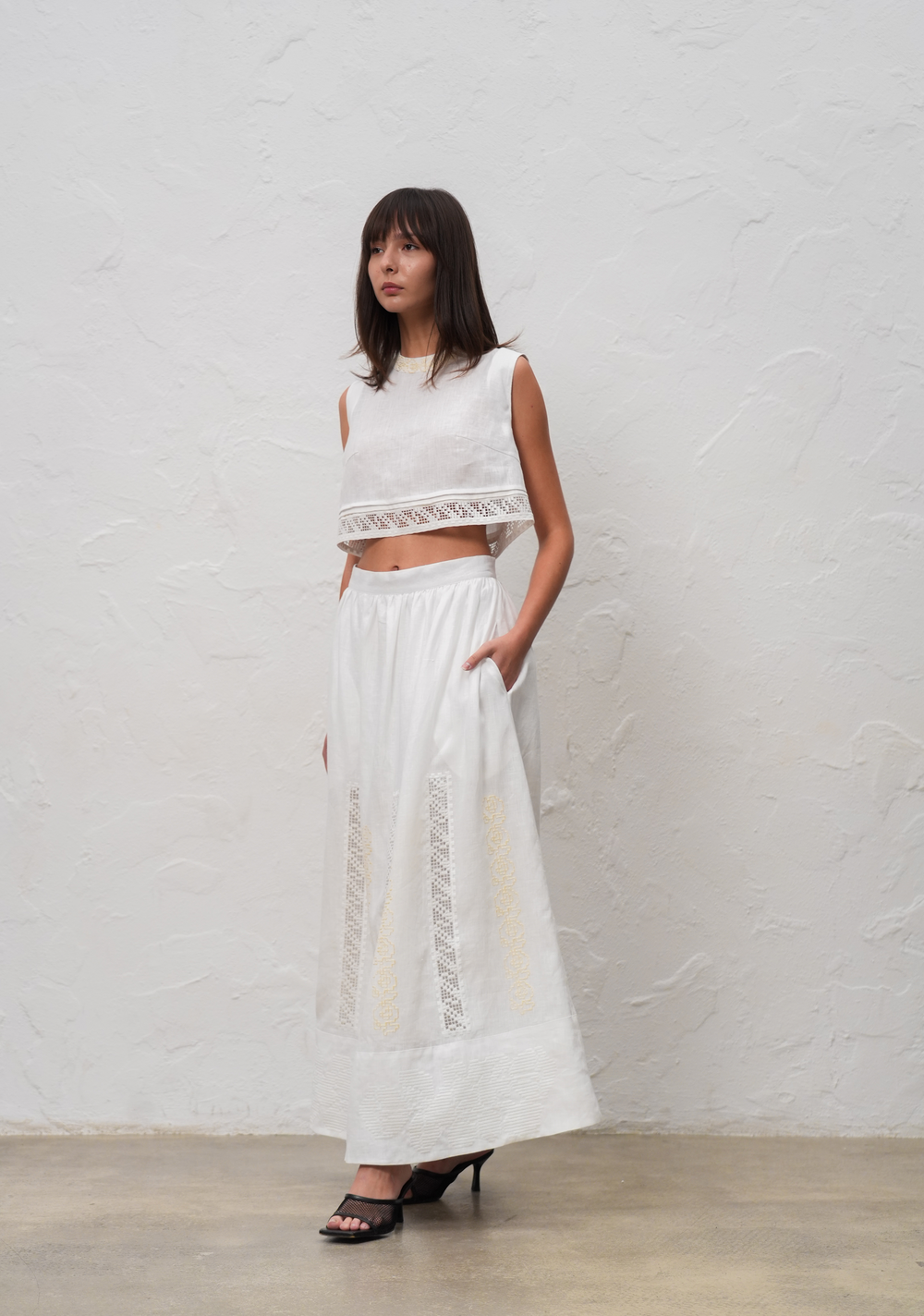 Hand-embroidered folk linen skirt with Richelieu cutwork – back view