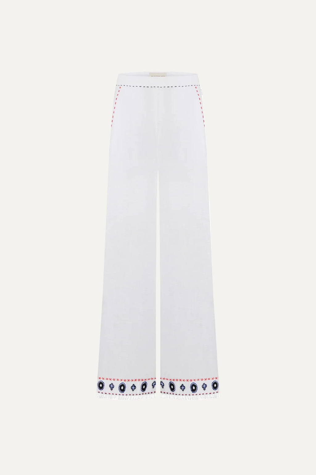White pants with decorative hem embroidery