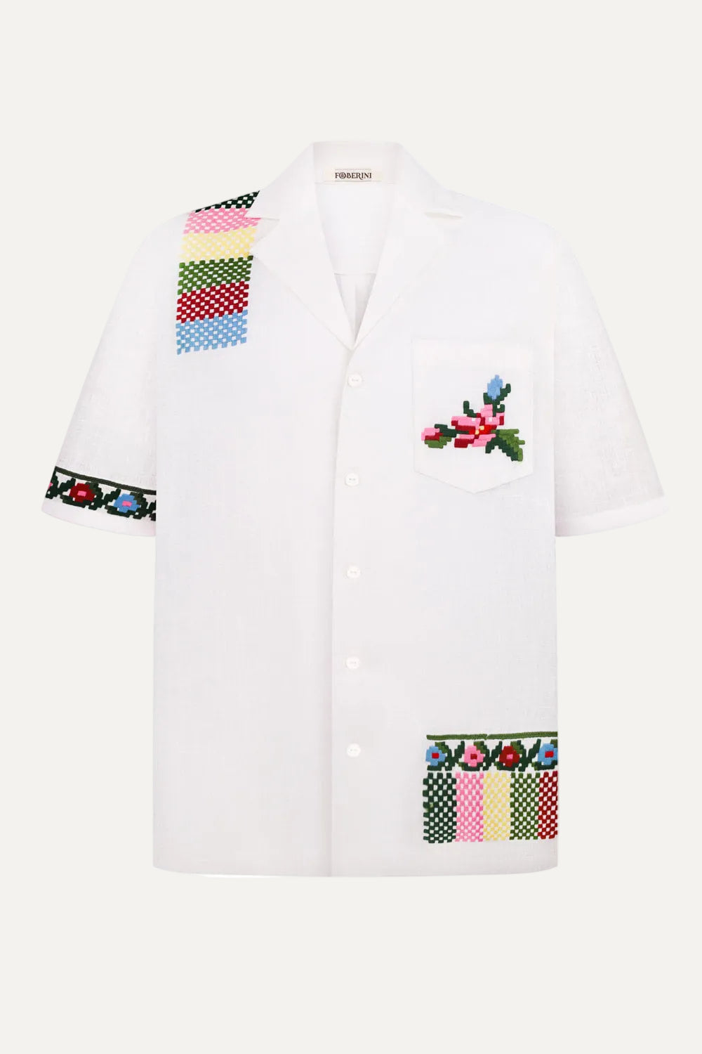 White shirt with colorful floral and geometric embroidery on a white background