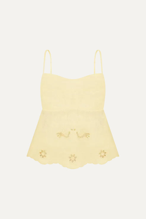 Yellow lace camisole with floral details on a white background