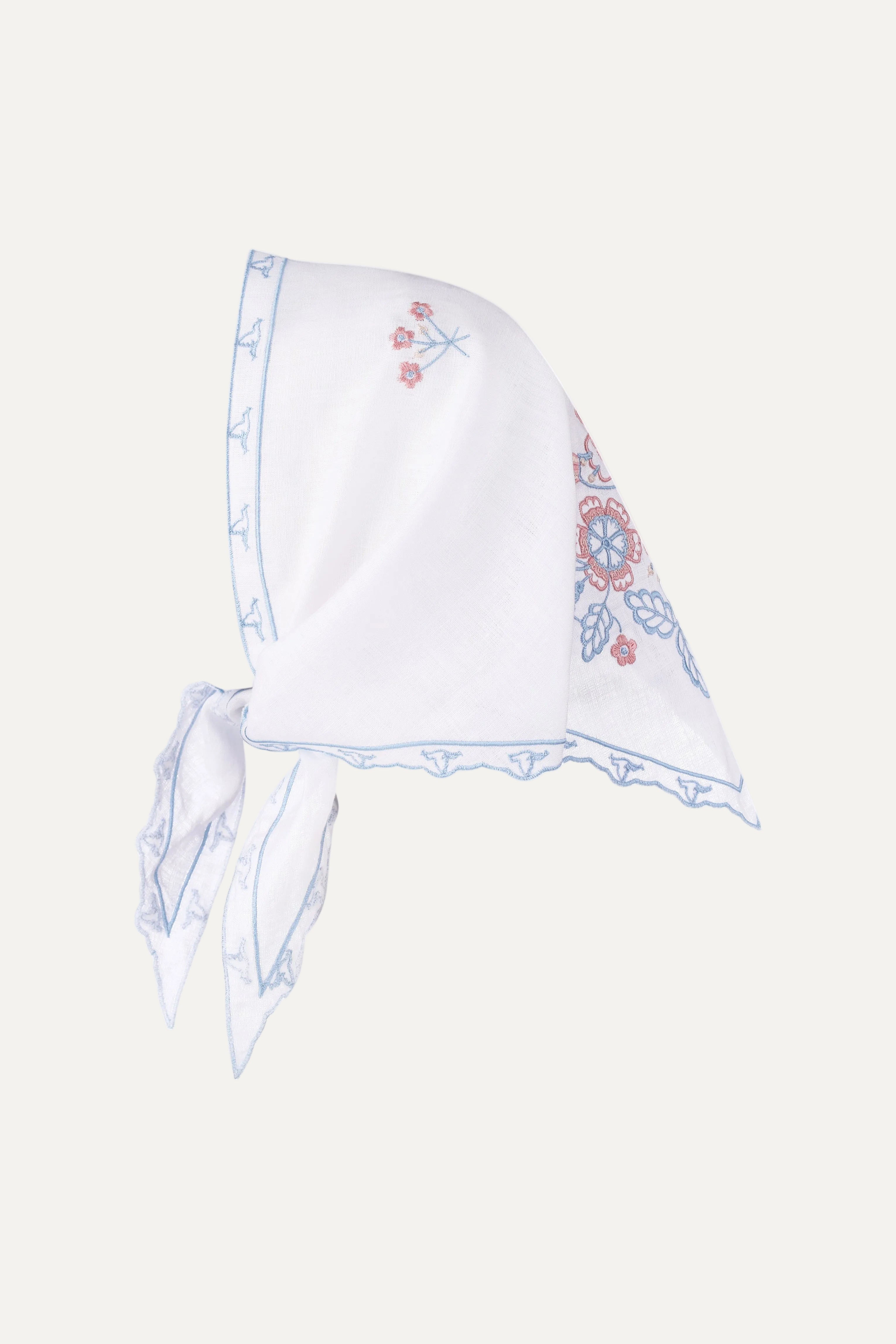 White headscarf with floral embroidery on a white background