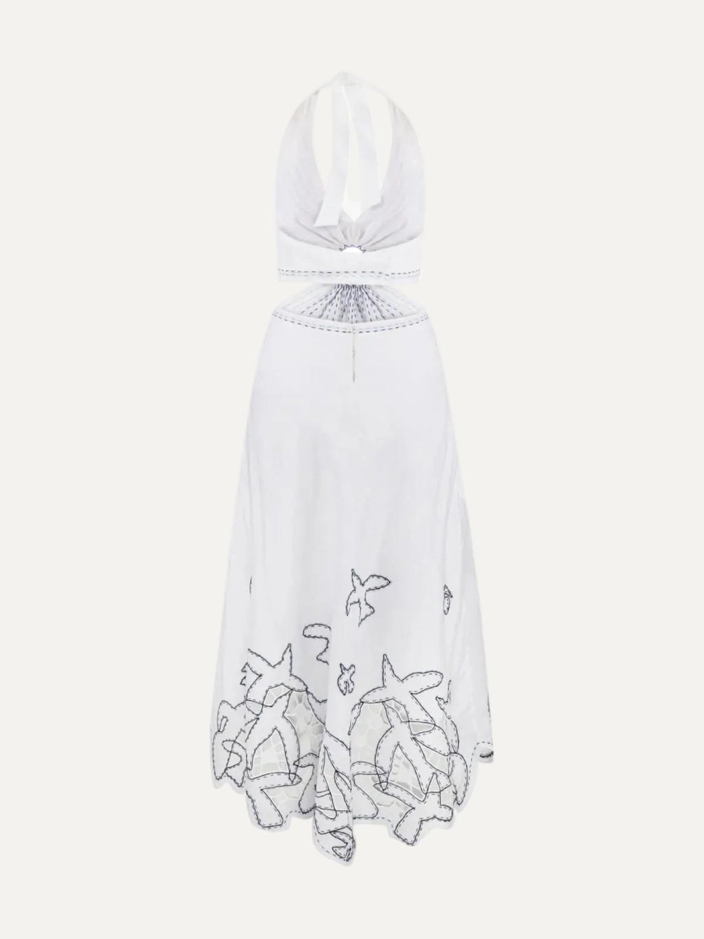 White sarafan with embroidered details on a white background