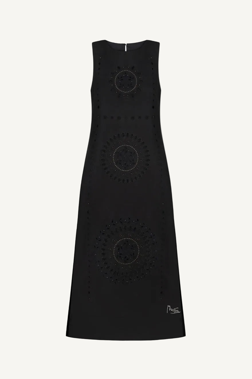 Black dress with circular cut-out patterns 