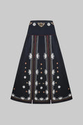 Black skirt with intricate white embroidery on a white background