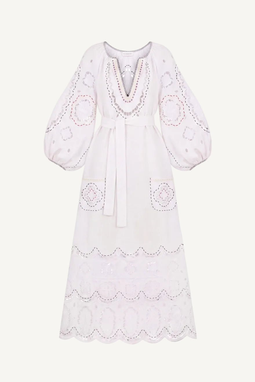 White dress with intricate embroidery on a white background