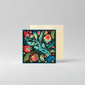 Colorful floral design on a greeting card with a beige envelope.