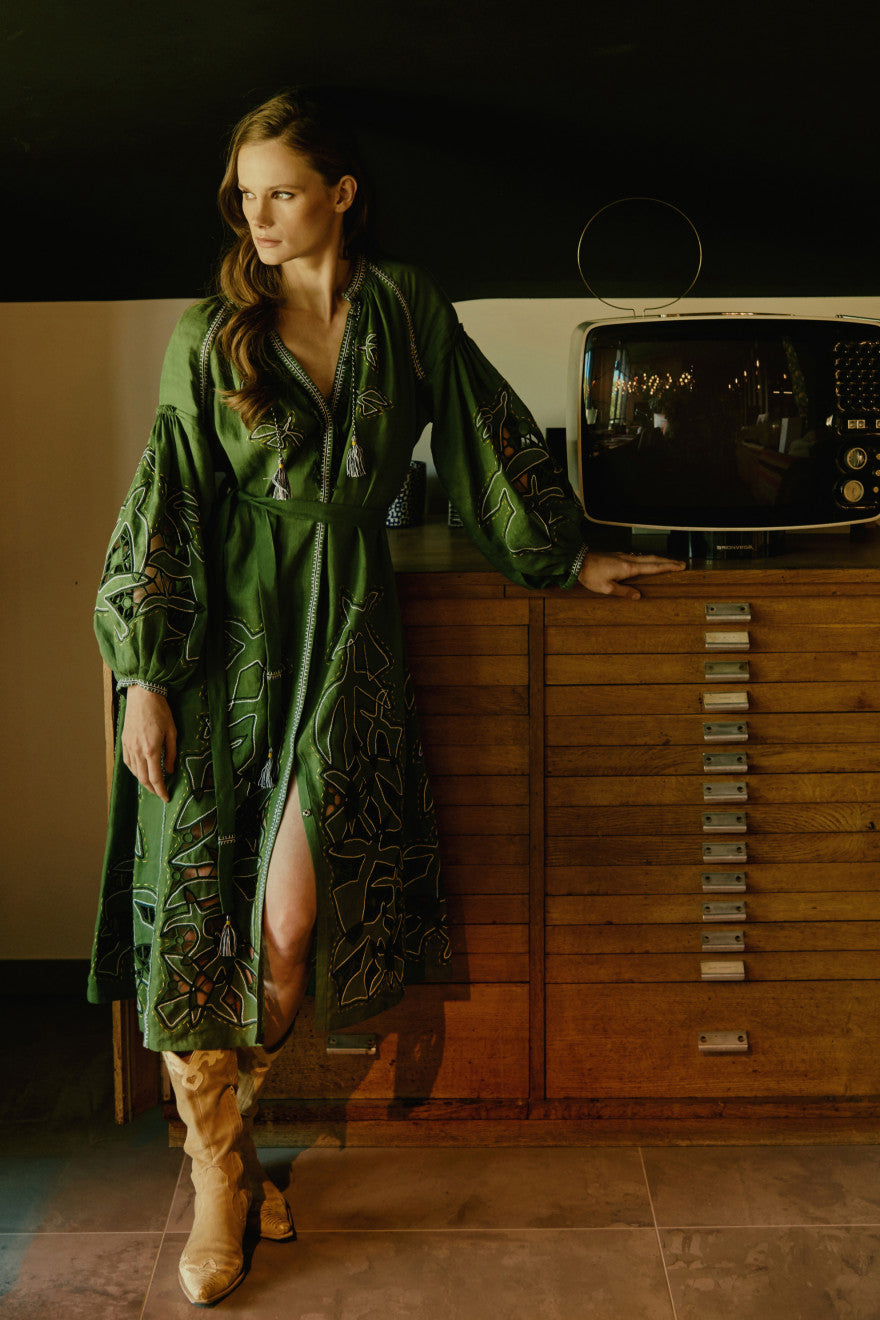 Model wearing the Flying Home green cutwork embroidered linen midi dress