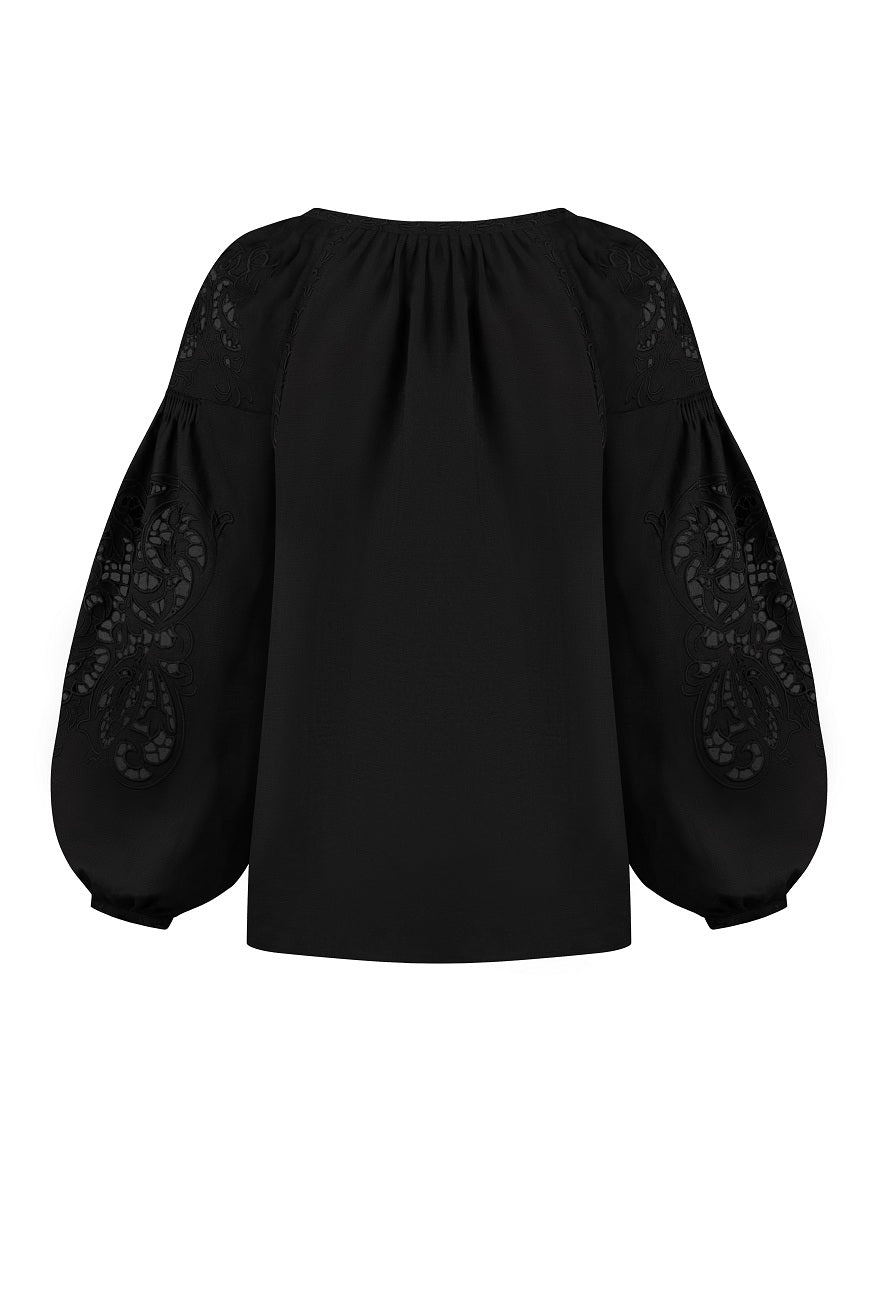 Black-on-black floral Richelieu cutwork embroidery on the sleeve - embroidery detail