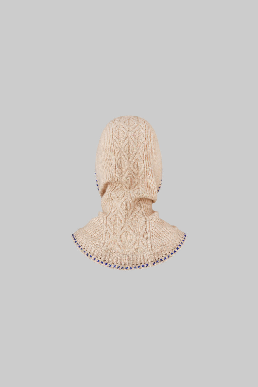 Beige knitted balaclava on a white background