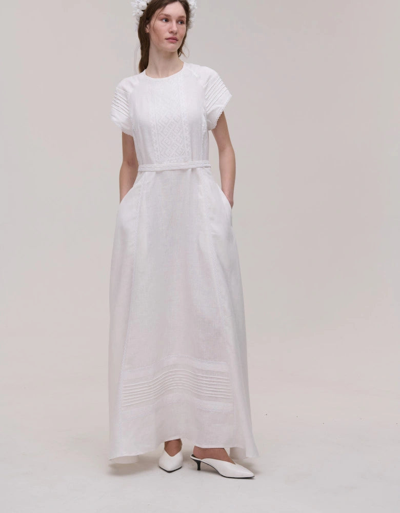 Model wearing the Kniahynia white linen midi dress