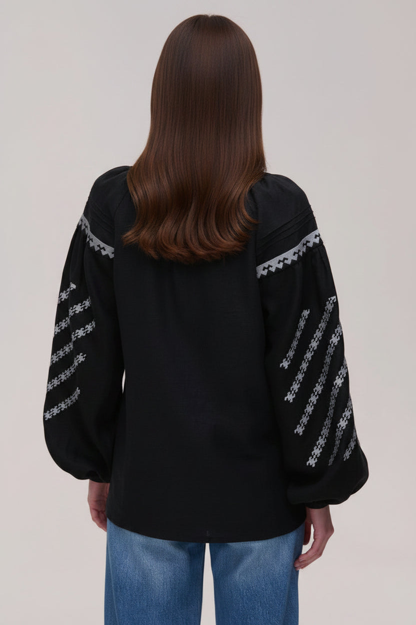 Black blouse with white embroidery on sleeves and back