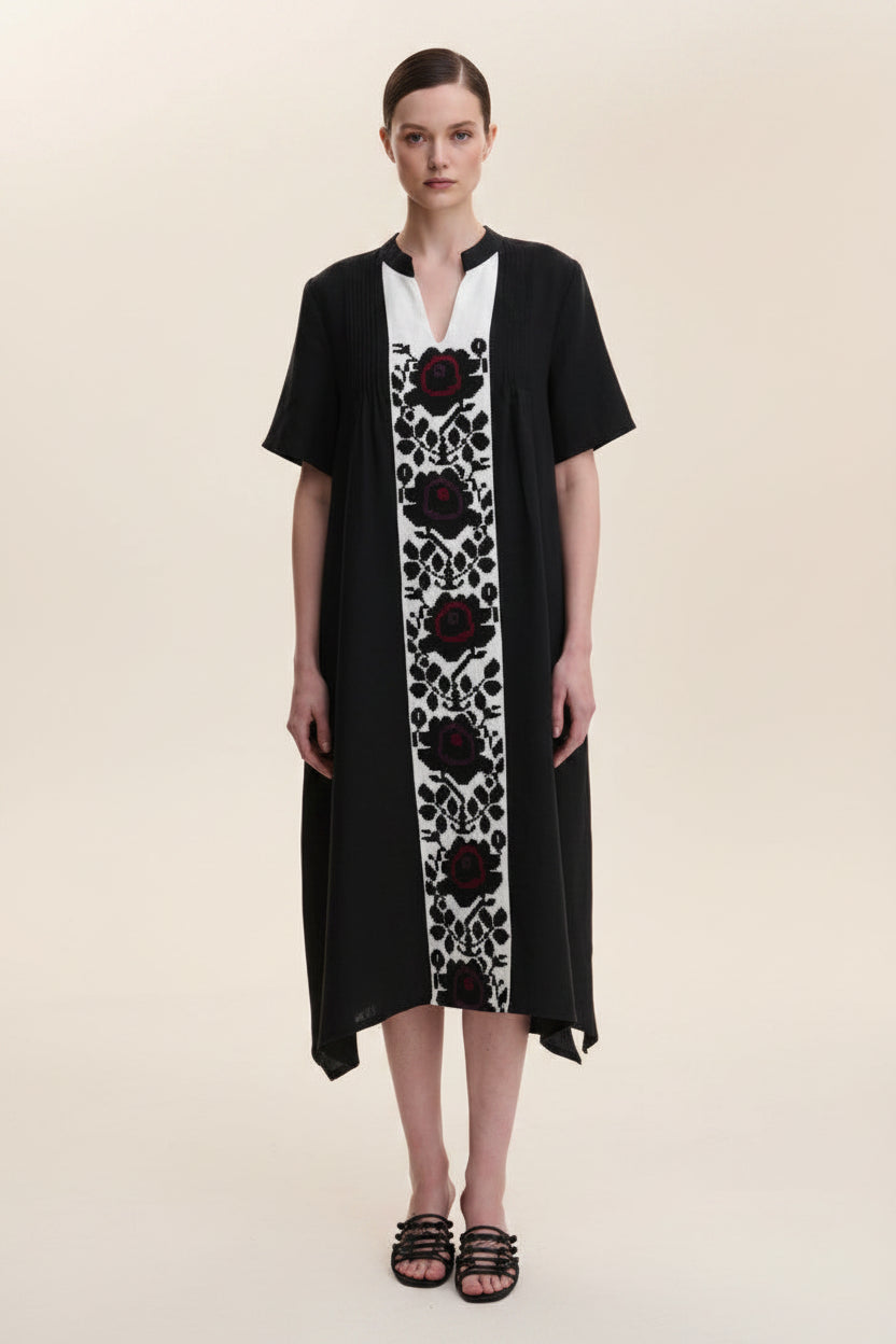 Blouse Roumaine Shop black dress with floral patterns